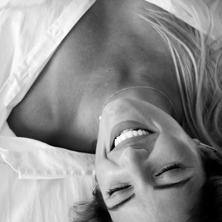 Kaveri Mehta, Lead Design Curator at Open Stable Origin Way, reviewing corporate floral arrangements